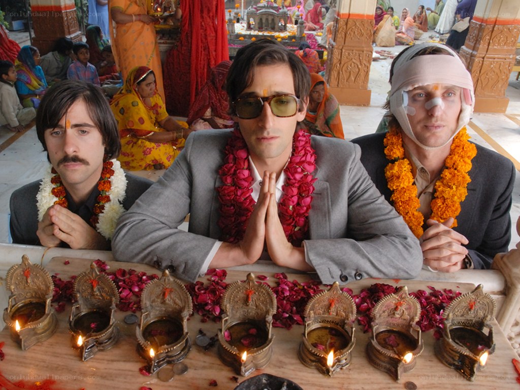 Men in prayer at a temple