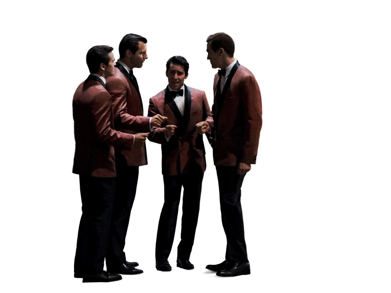 men in red tuxedos in conversation
