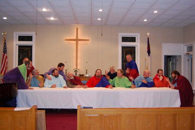 Men in robes at a table