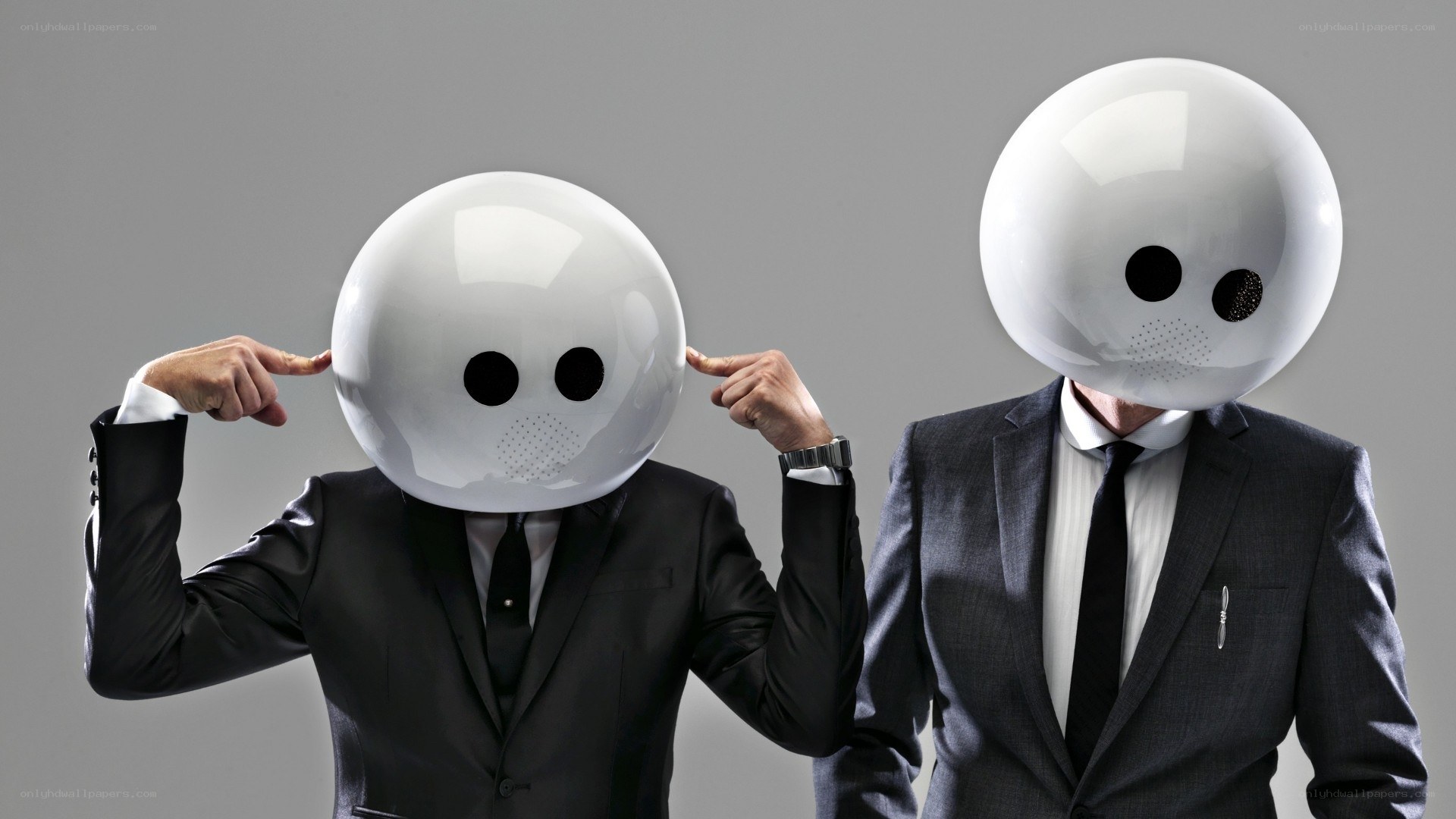 men in robot head masks