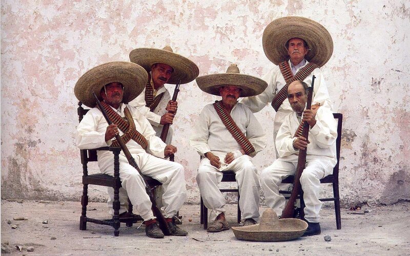 Men in sombreros with rifles
