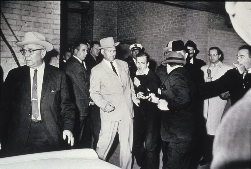 Men in suits and hats at night