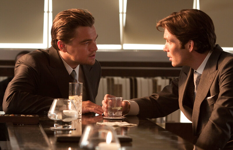 Men in suits at a bar