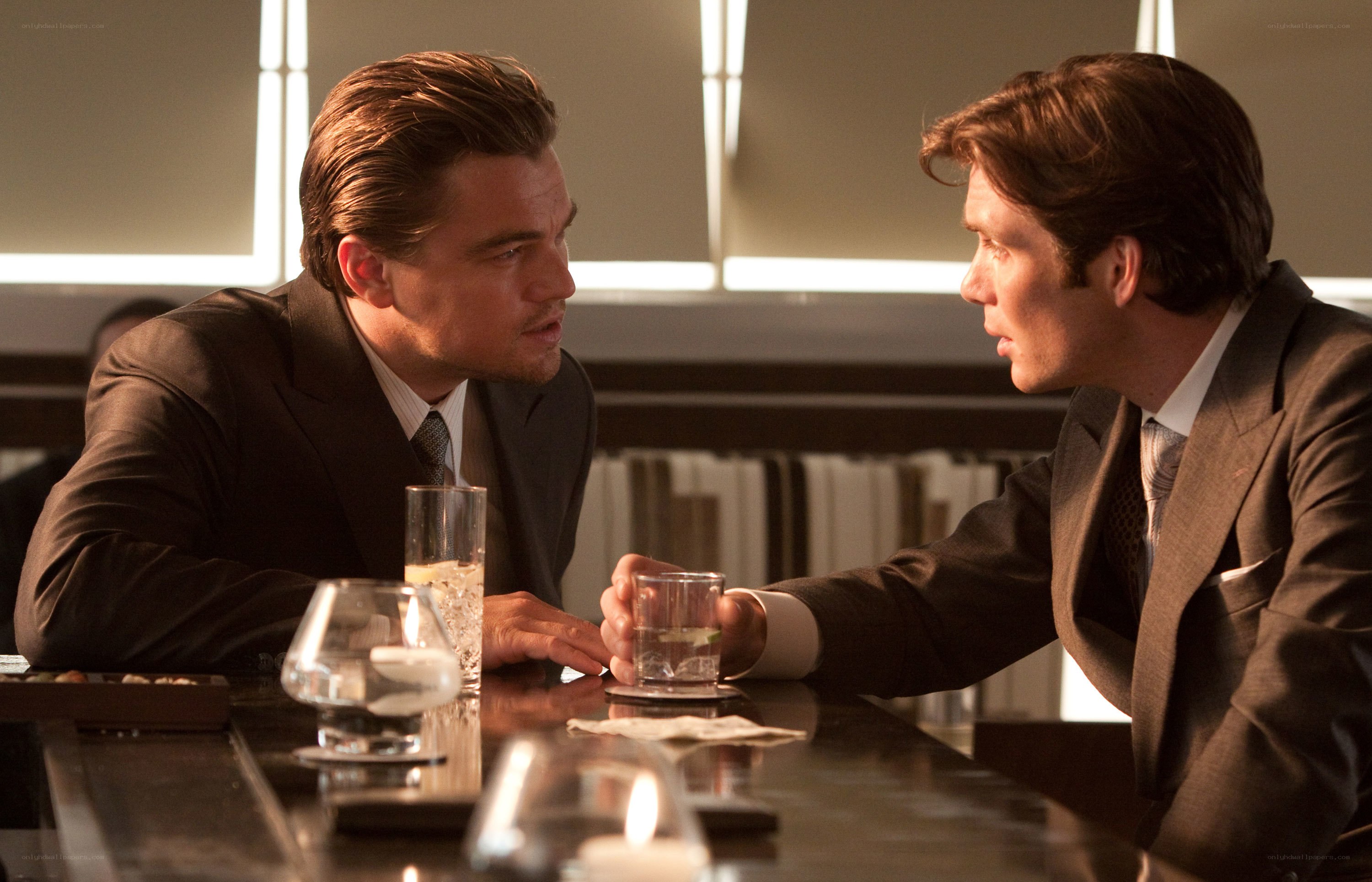 Men in suits at a bar