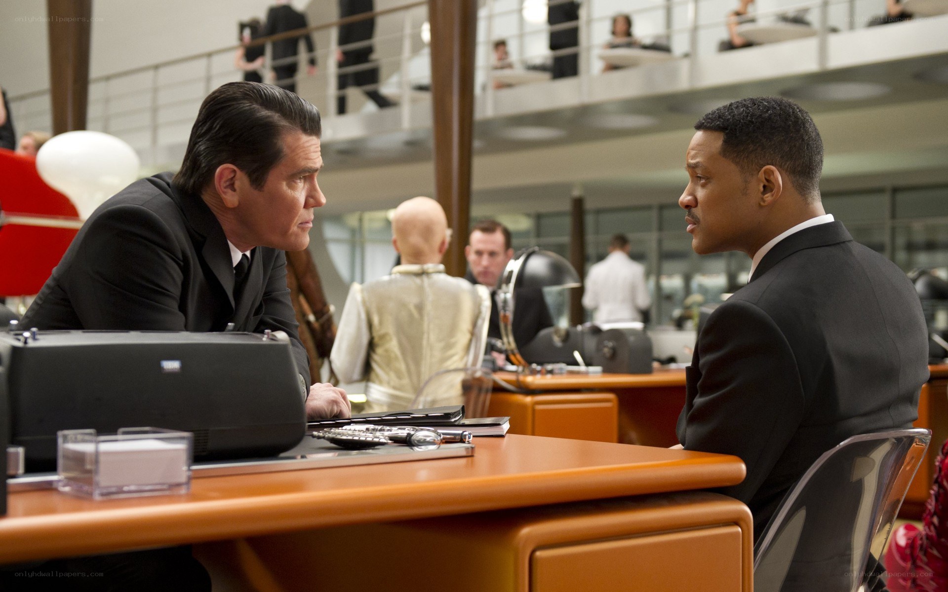 Men in suits at a desk