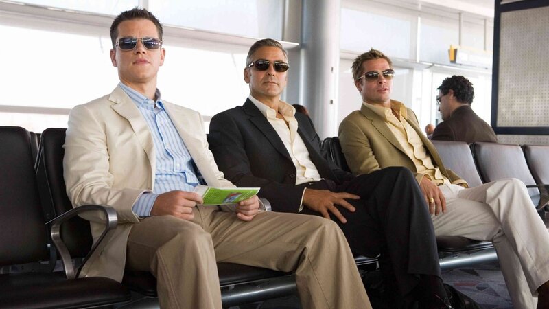 men in suits at airport
