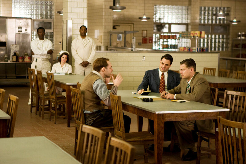 Men in Suits at Table
