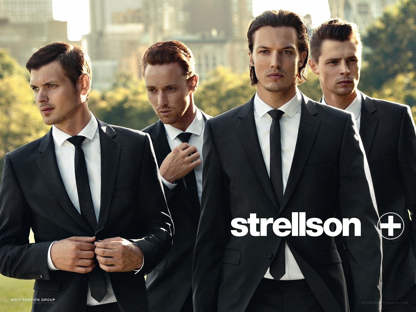 Men in suits in city park