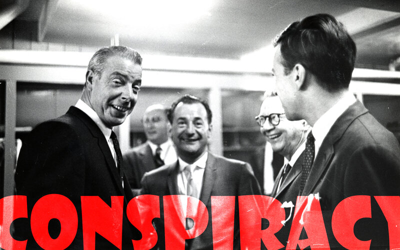men in suits laughing