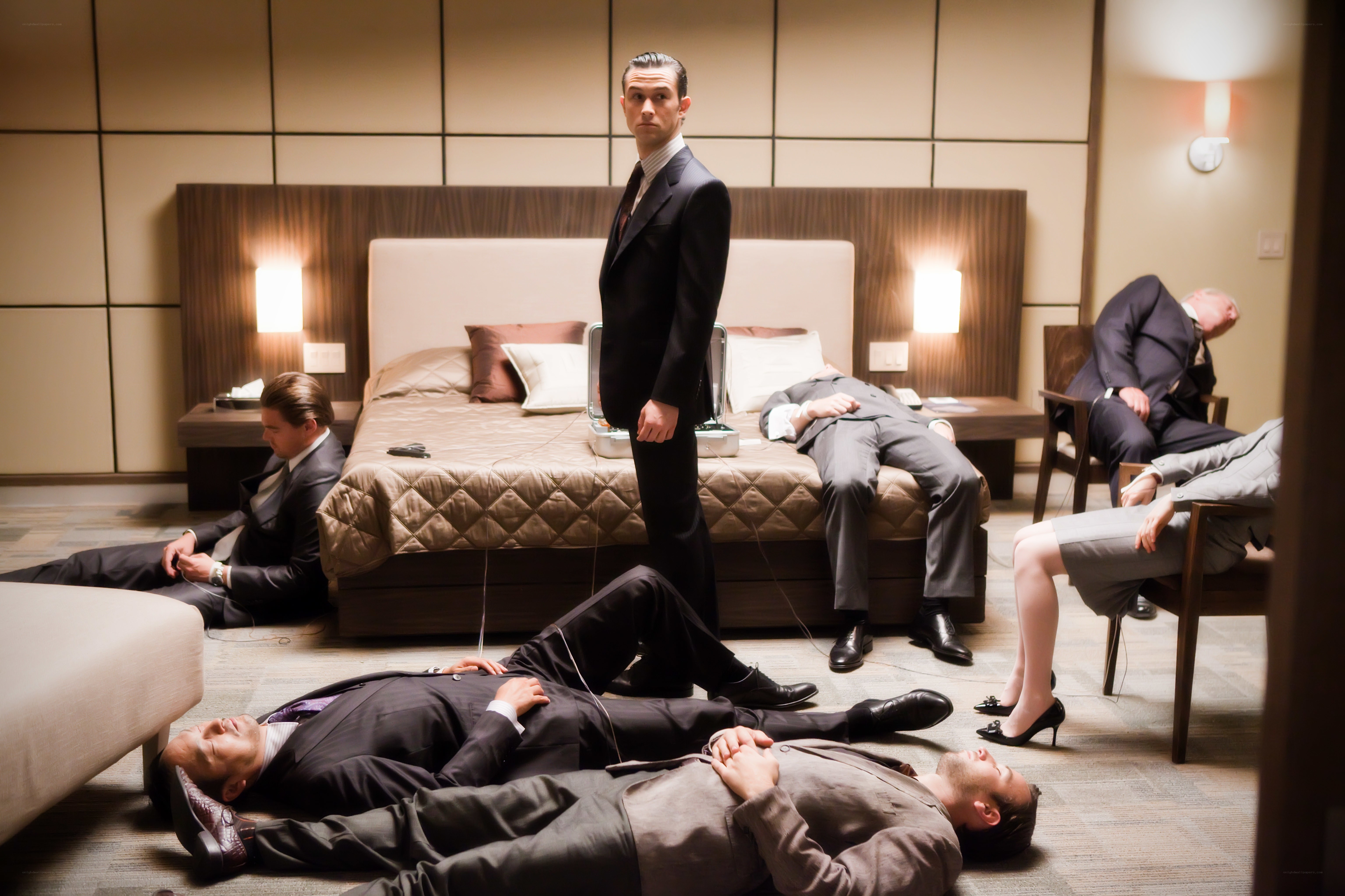 Men in suits lying on floor