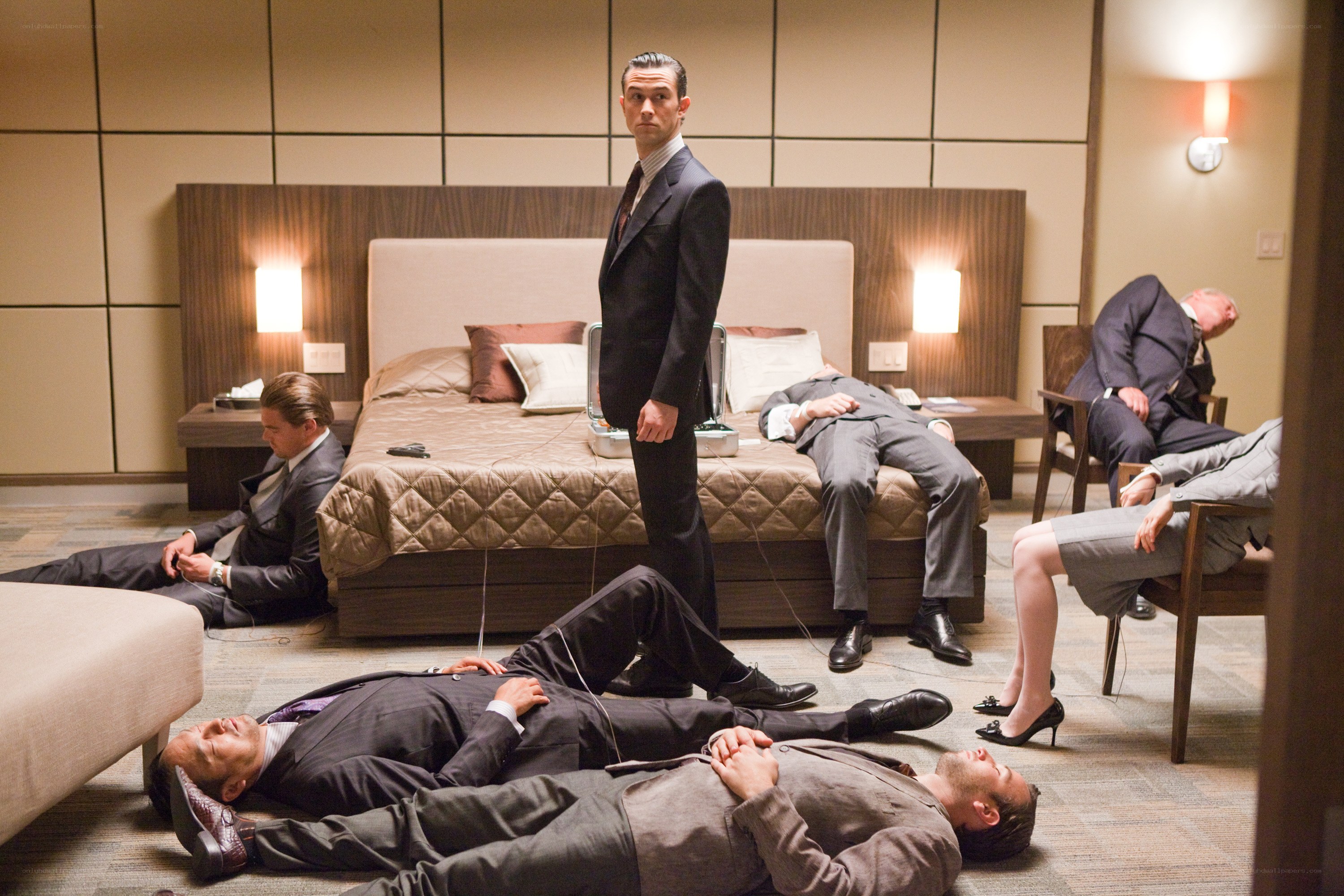 Men in suits lying on floor