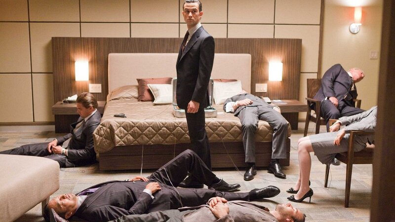 Men in suits lying on floor