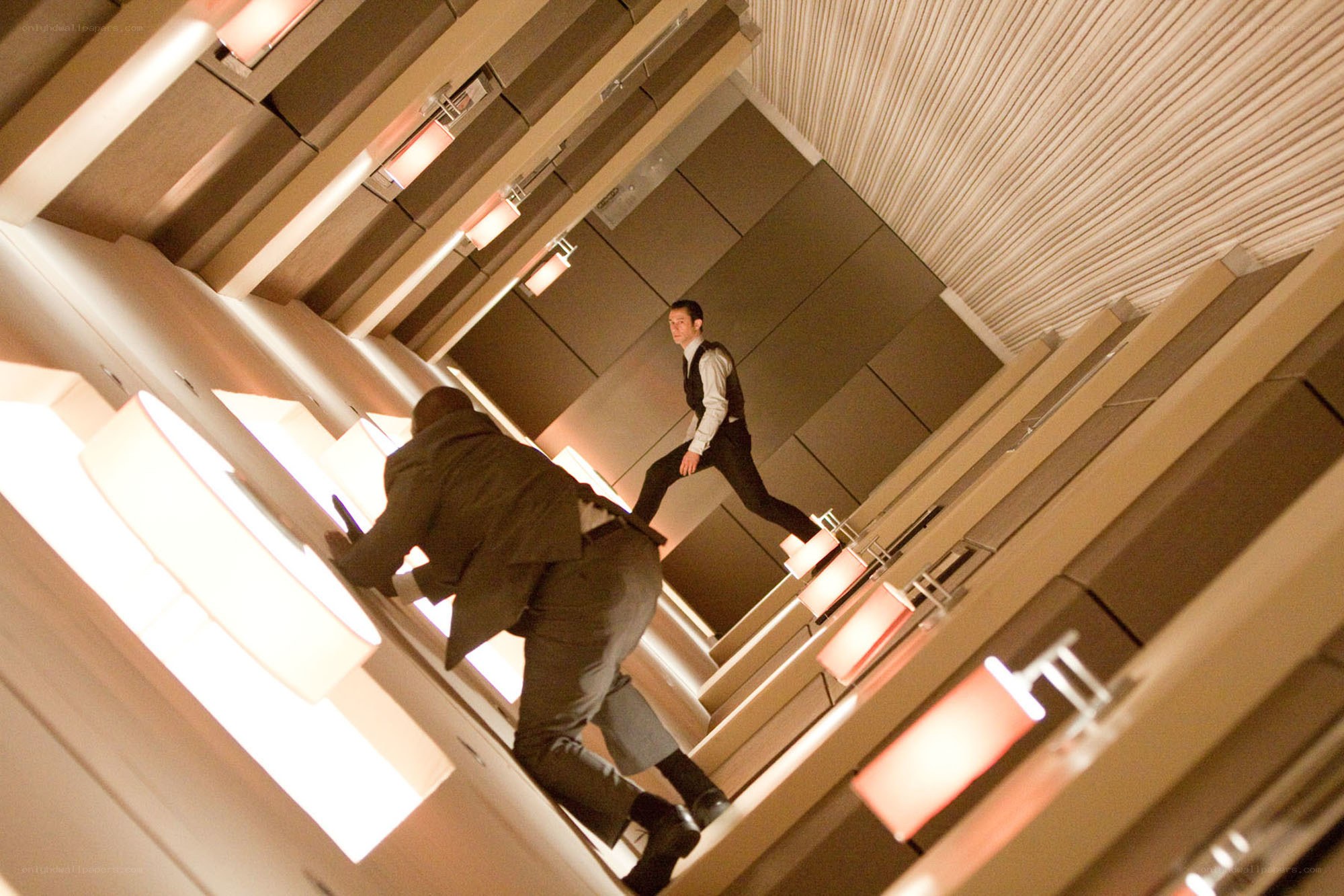 Men in suits on a tilted staircase