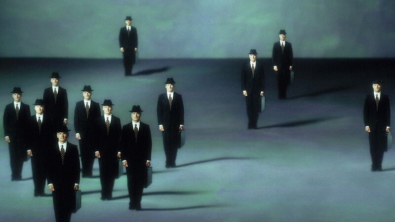 Men in suits walking in unison