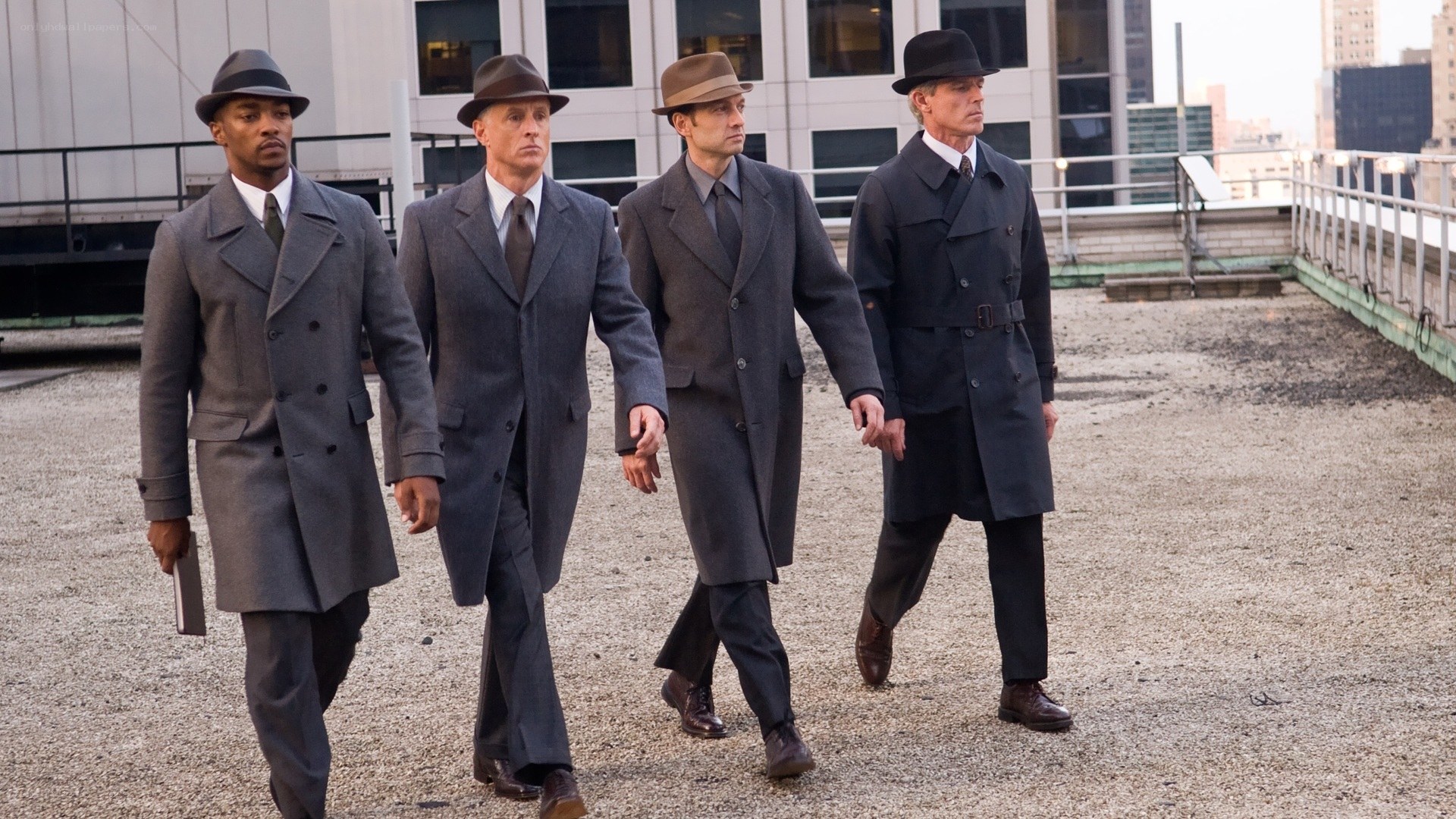 men in suits walking on rooftop