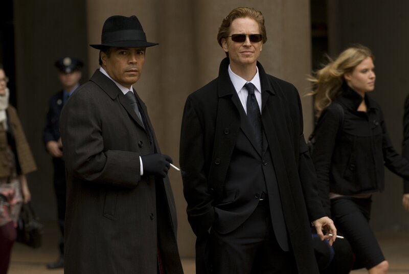 Men in suits walking outside