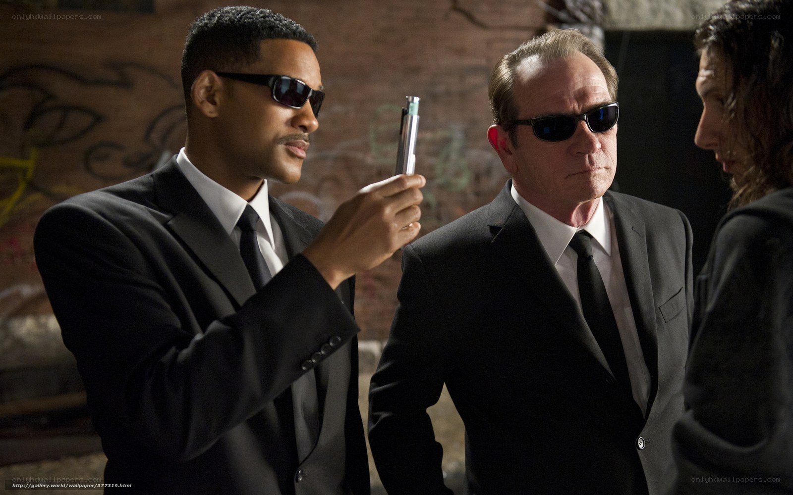 Men in suits with a device