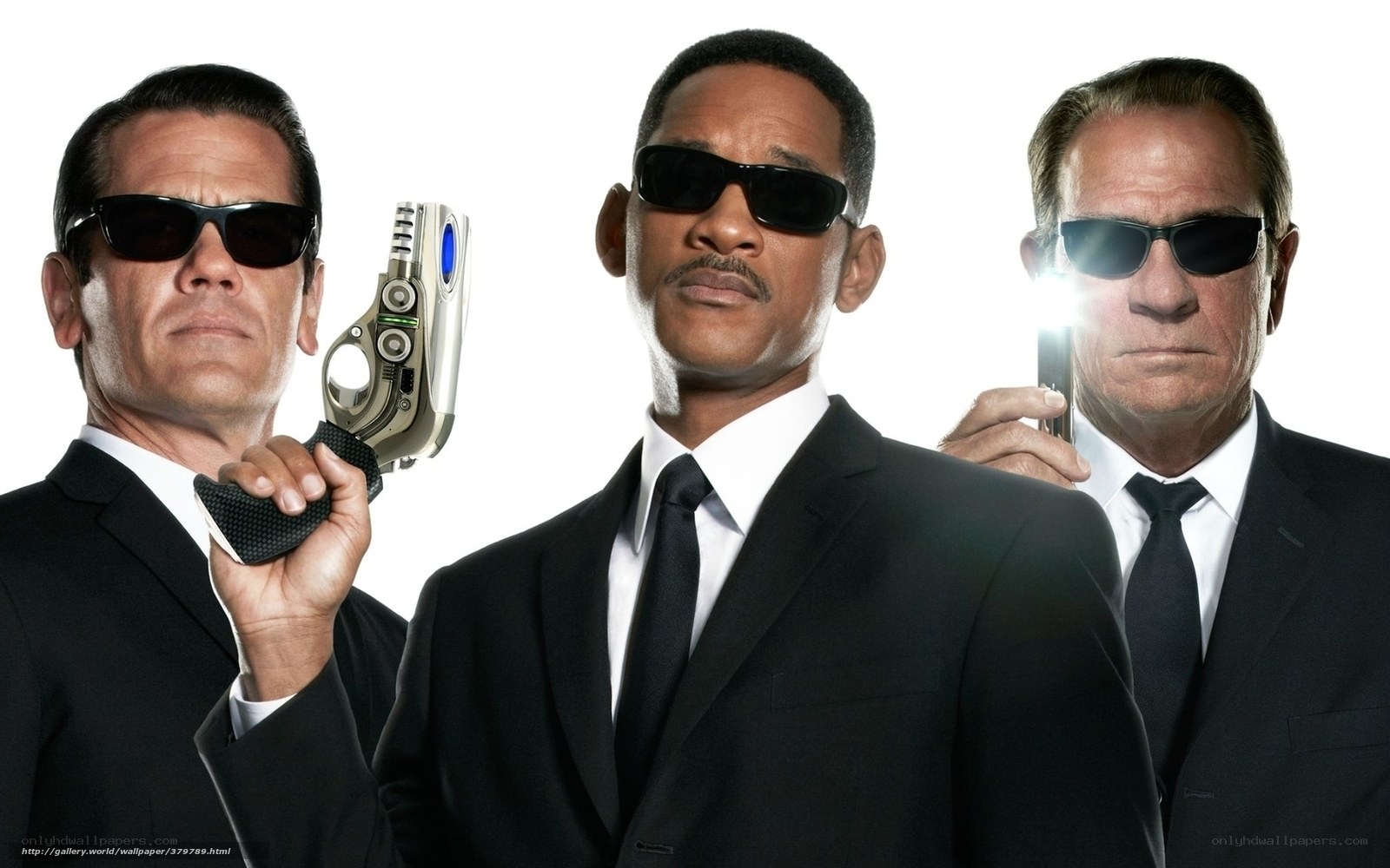 Men in suits with futuristic guns