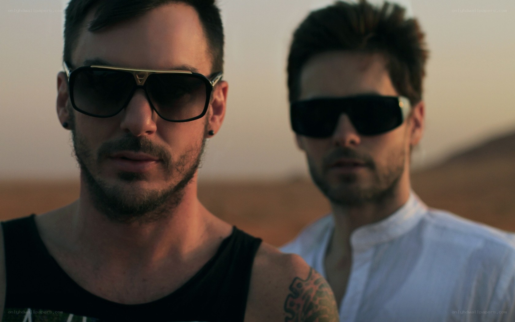 men in sunglasses in desert