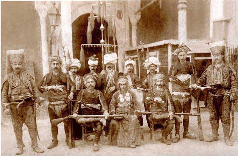 Men in Traditional Clothing — Brown