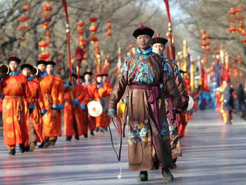 Men in Traditional Costumes — Brown