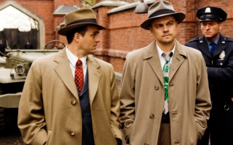 Men in trench coats and hats