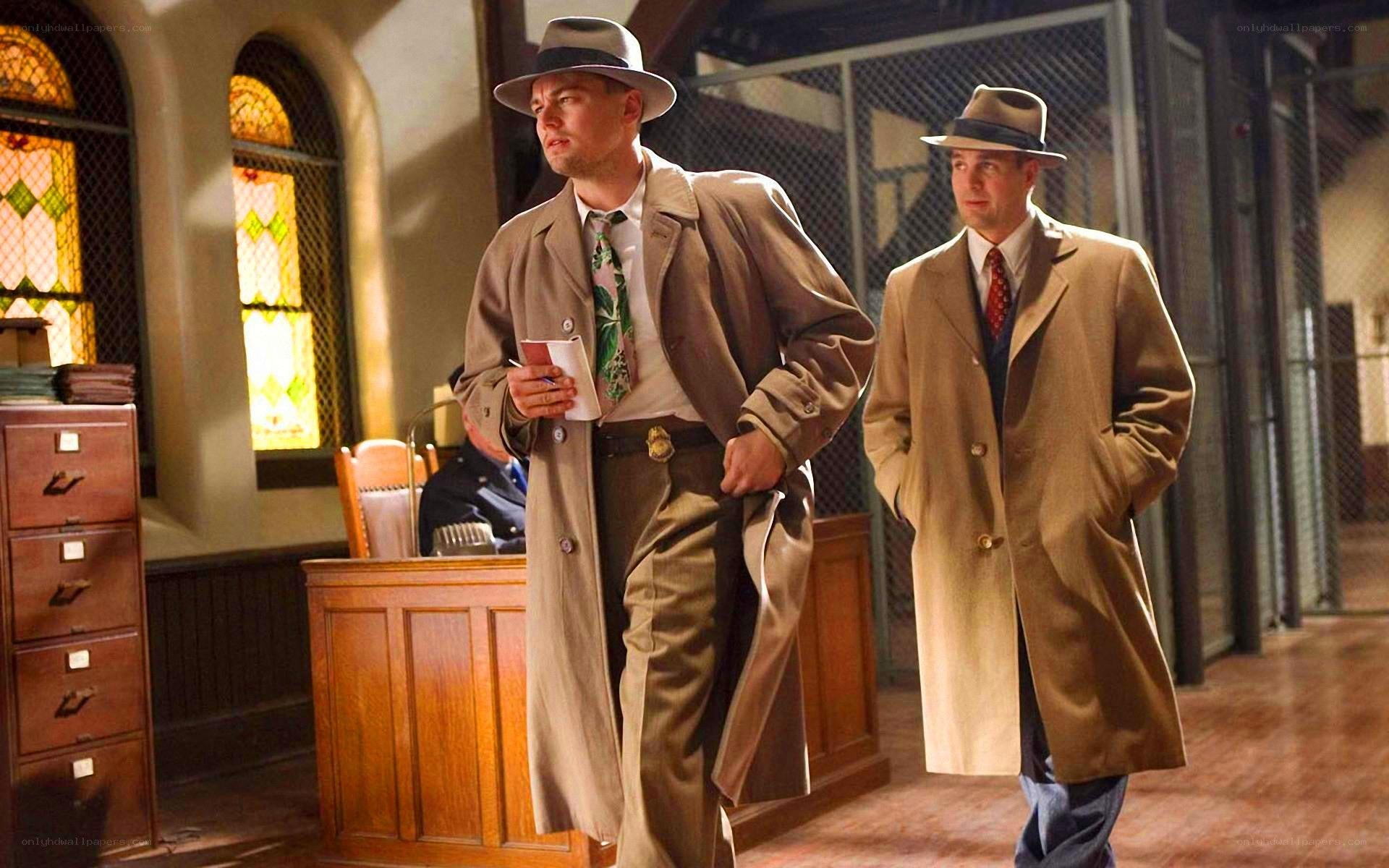 Men in trench coats walking