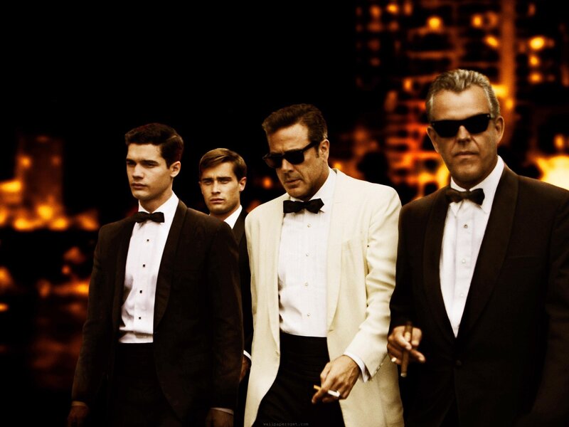 Men in tuxedos walking at night