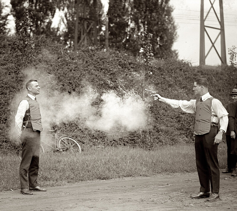 Men in Vests with Gun
