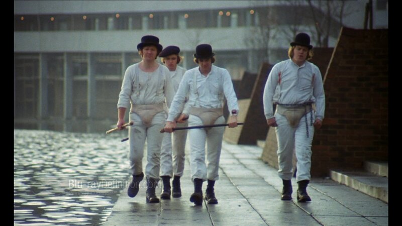 men in white suits walking