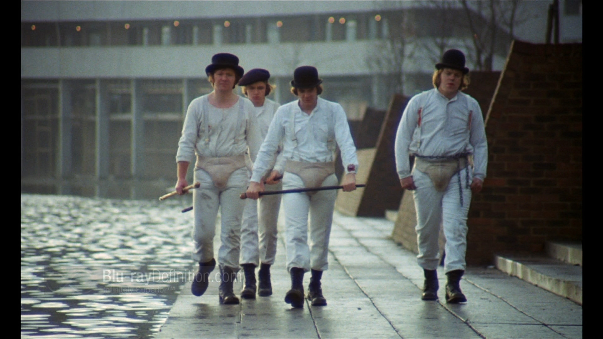 men in white suits walking