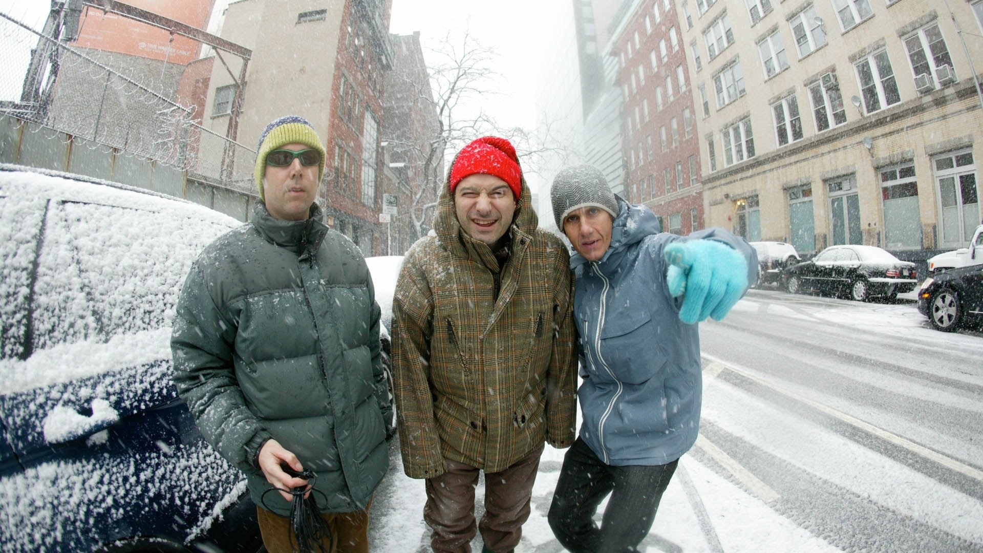 Men in winter coats in snow