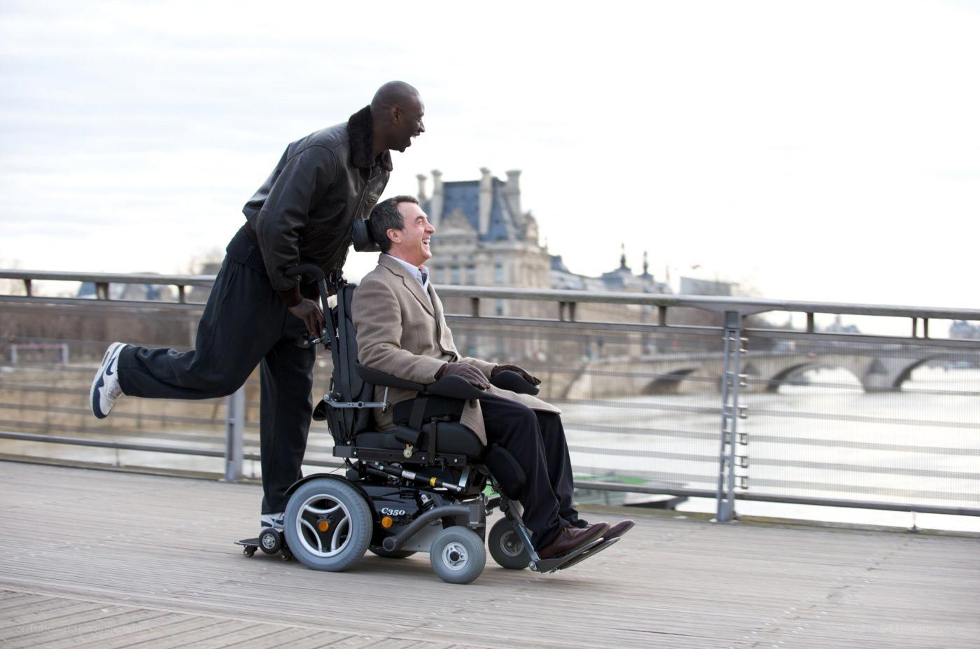 Men laughing on a bridge