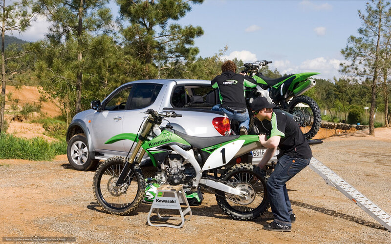 Men Loading Dirt Bikes