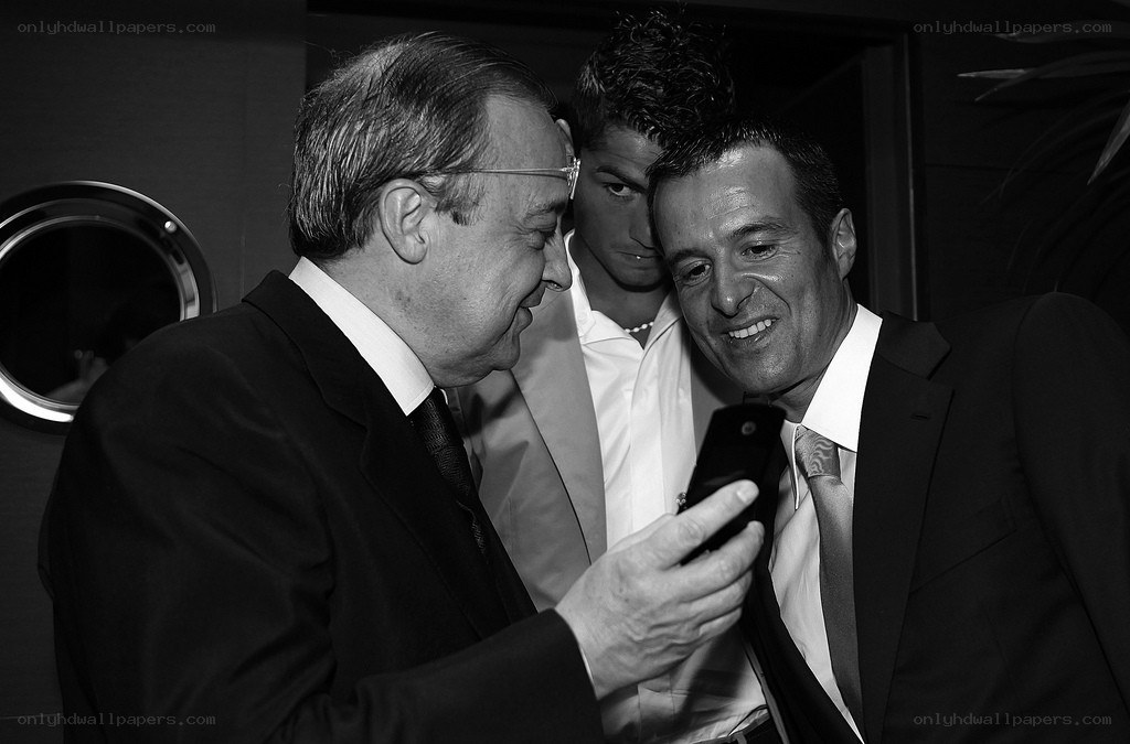 Men looking at a phone together