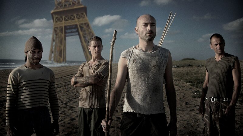 Men on a beach with Eiffel Tower