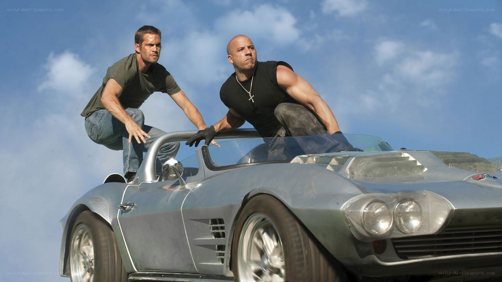 Men on a classic car