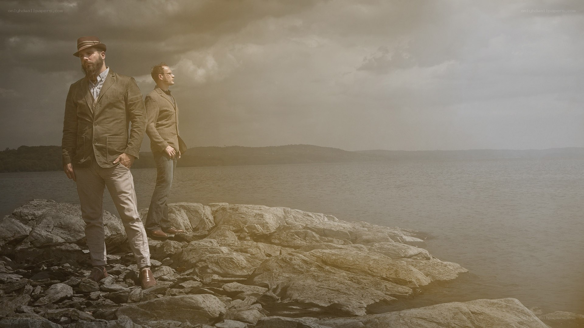 Men on a rocky shore