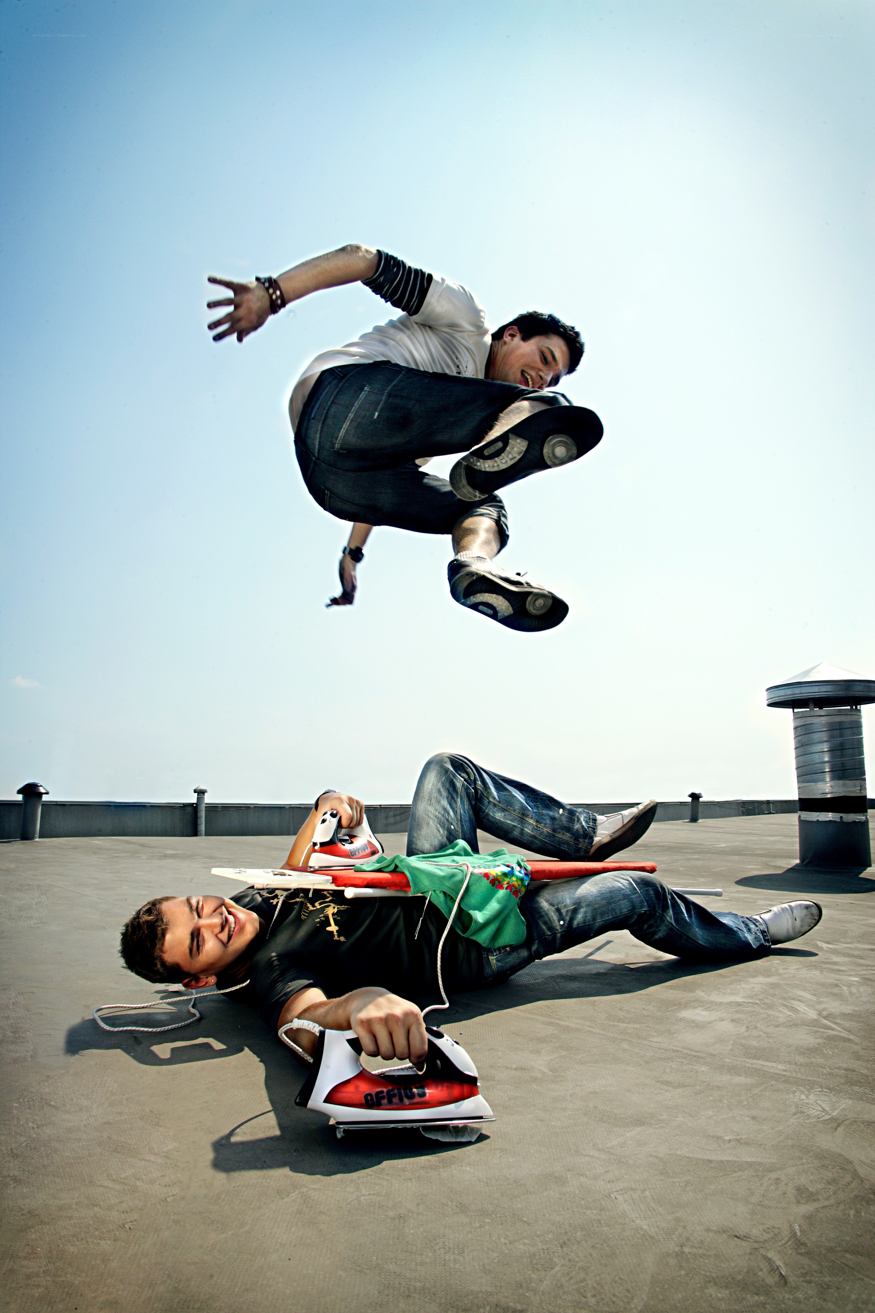 Men on a rooftop with iron