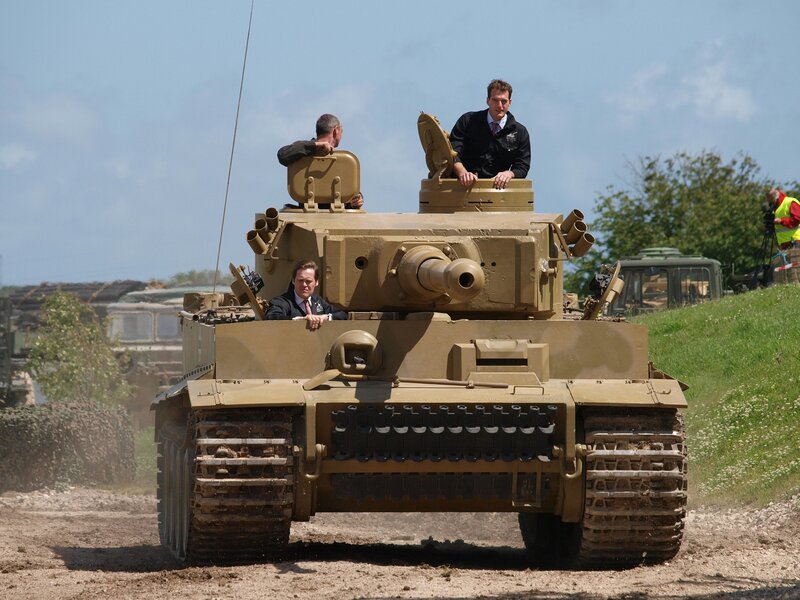 Men on a tank display