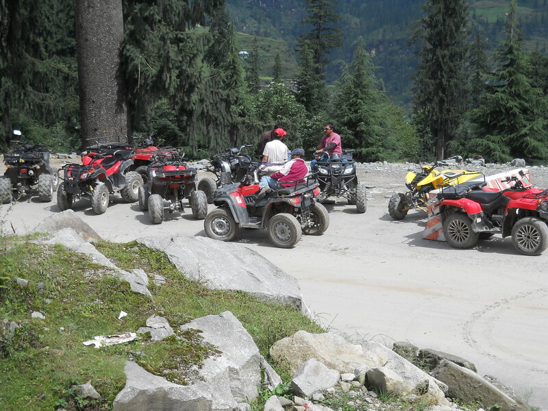 Men on ATVs in Forest