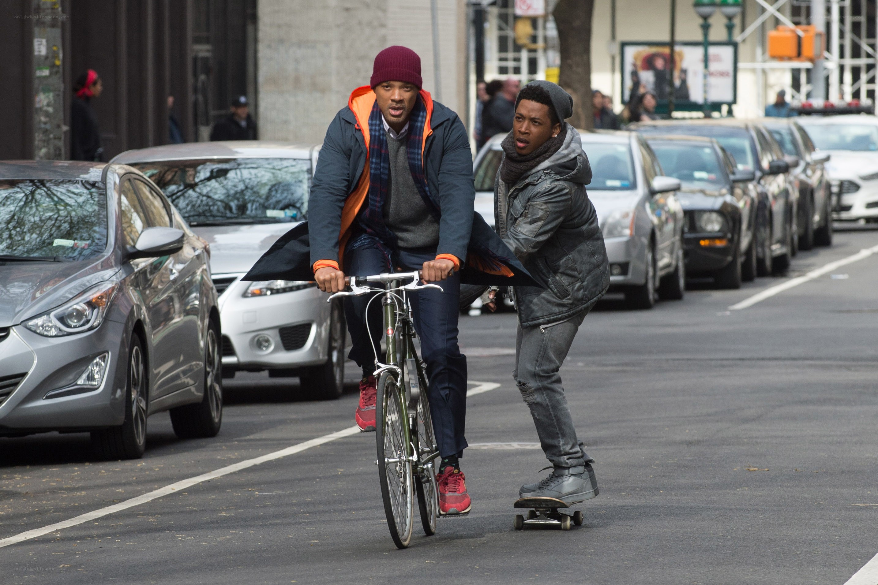Men on bike and skateboard