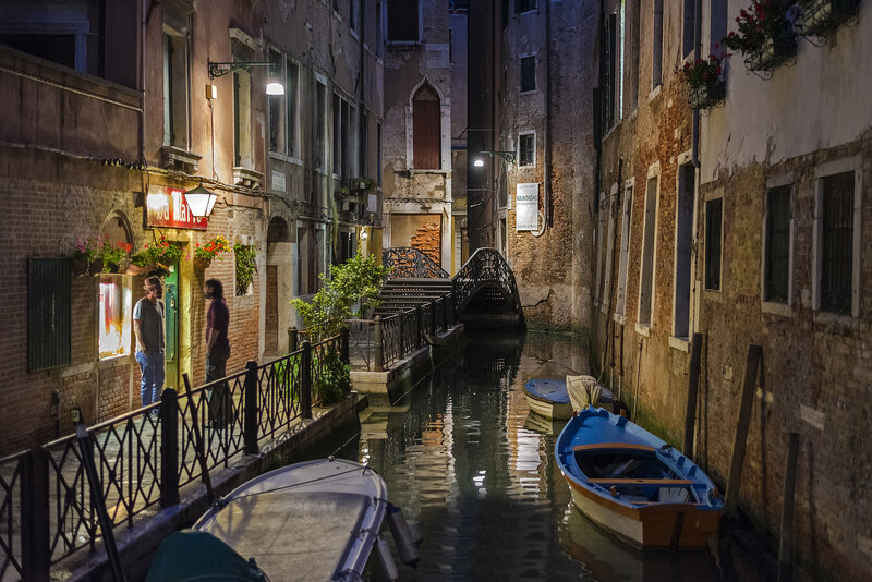 Men on Canal Walkway