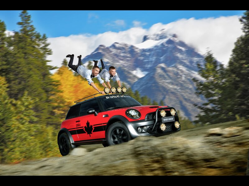 Men on car roof in mountains