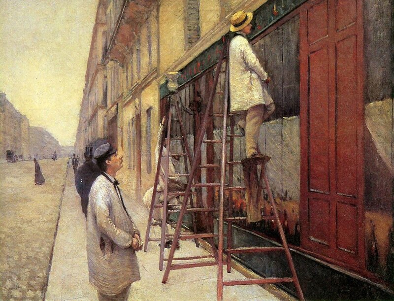 Men on ladders painting storefront