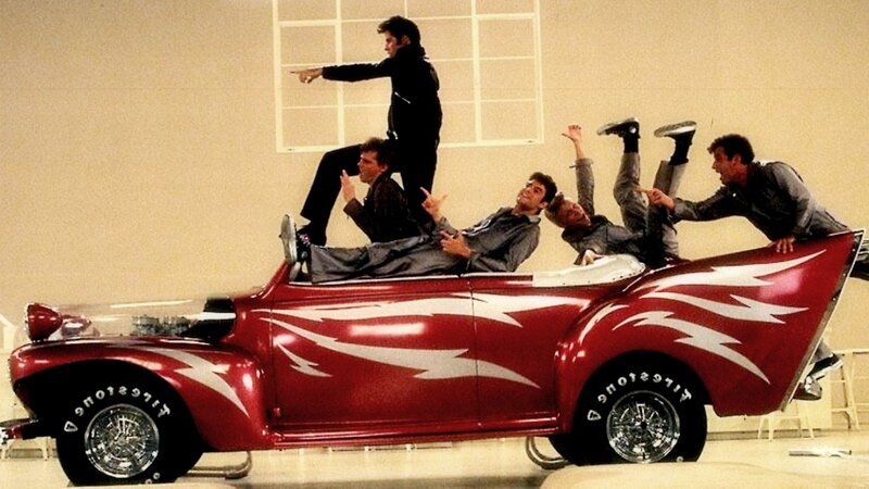 Men on Red Car
