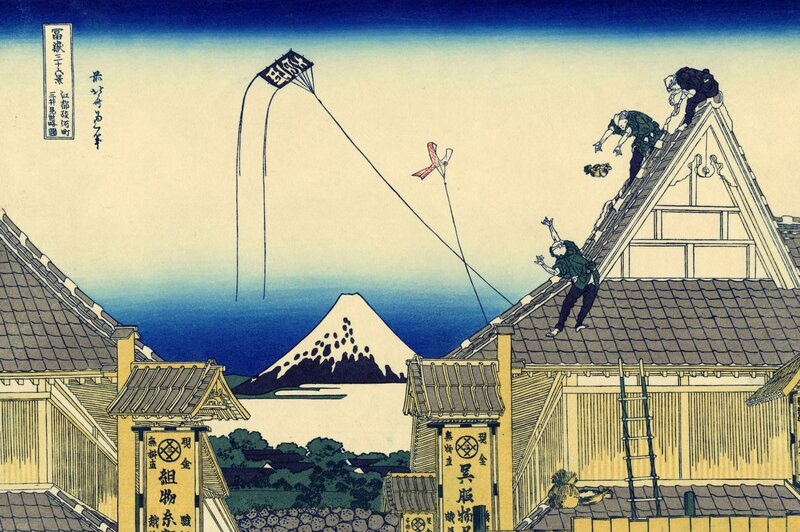 Men on Rooftops Flying Kites