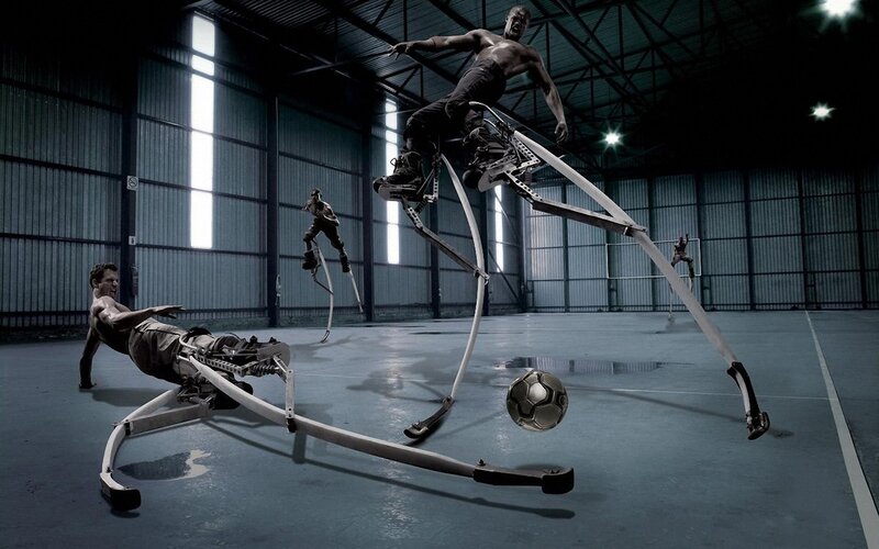 Men on spring-loaded stilts playing soccer