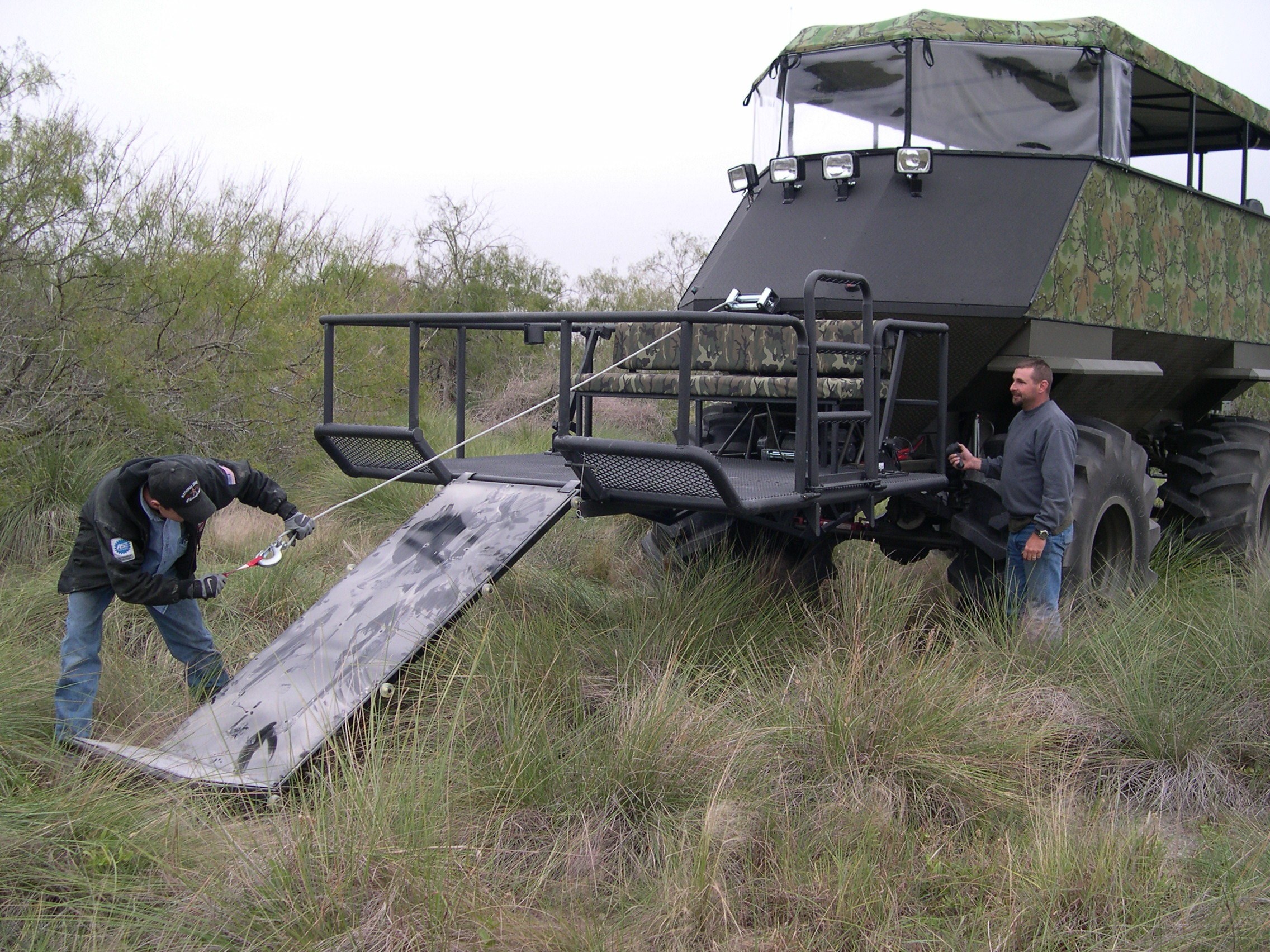 Men operating a swamp buggy