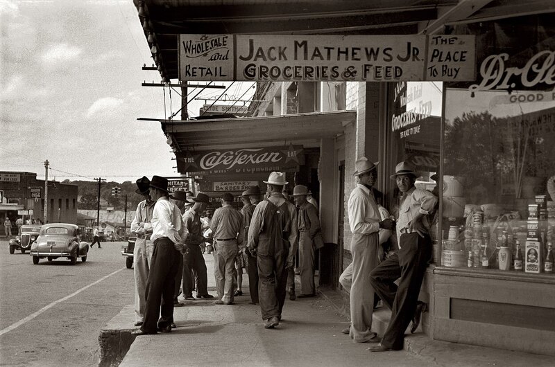 Men outside a grocery store
